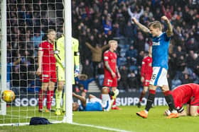 Rangers' Jason Cummings celebrates as Falkirk's Aaron Muirhead hits the ball into his own net in the last meeting of the two sides