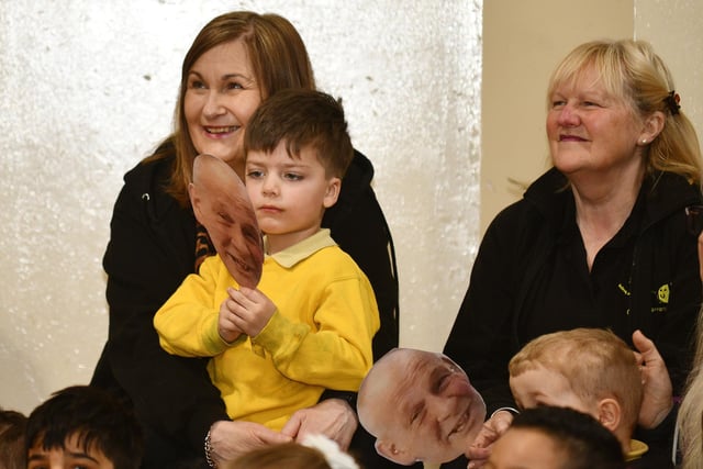 The entire school was on hand - with their special Mr Aitchison masks - to say goodbye to their beloved janitor