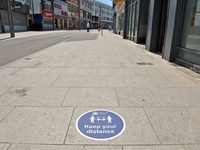 Doncaster town centre is being marked out with with social distancing signs, like these on the ground at Silver Street