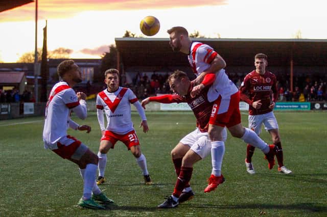 Players fight for possession of the ball (Pics Scott Louden)