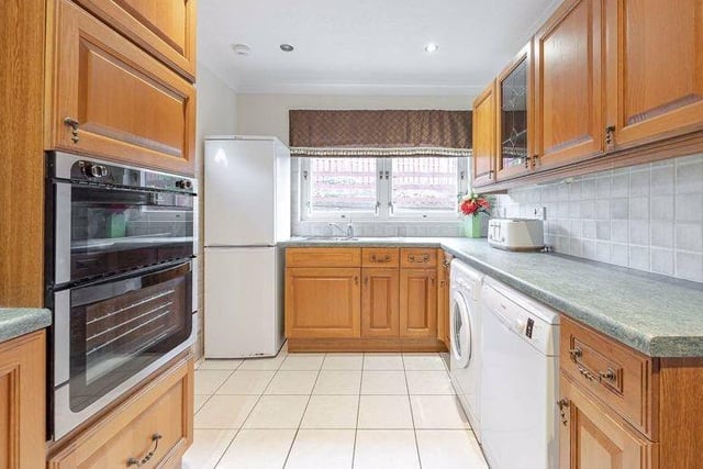 As well as a wide range of wall and base units, the kitchen also provides access to the back garden.