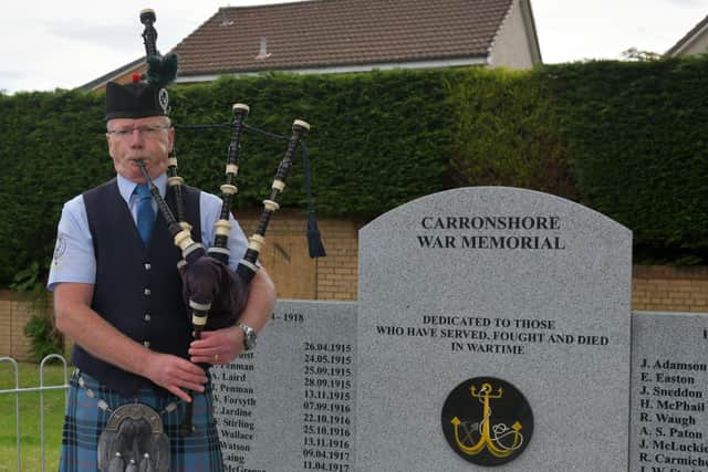 Piper Bryan Mackay, from Stenhousemuir, played at the Carronshore War Memorial at 10am while other pipers played across the world. Pic: Michael Gillen