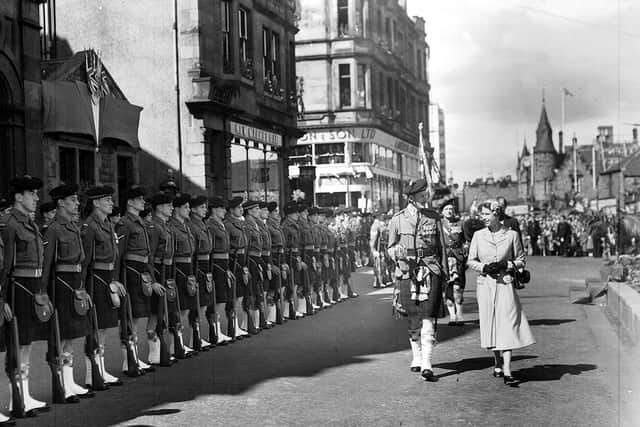 The Queen inspecting the guard of honour of the 7th Battalion Argyll and Sutherland Highlanders in Falkirk in 1955