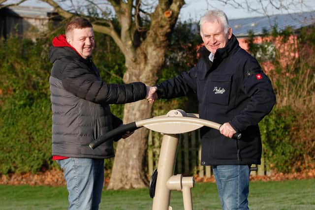 The new outdoor gym in Grangemouth's Inchyra Park is officially open for business as Adam Gillies, of Friends of Inchyra Park, attends the handover with Roy Auld of Proludic - the firm which installed the facility