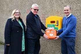 A new defibrillator has been installed outside Michael Matheson MSP's office at the east end of Falkirk High Street.  Pictured, from left, Elaine Grant (Falkirk Delivers business manager); Martin Stuart (trustee, Friends of Forth Valley First Responders) and Michael Matheson MSP.  (Pic: Michael Gillen)