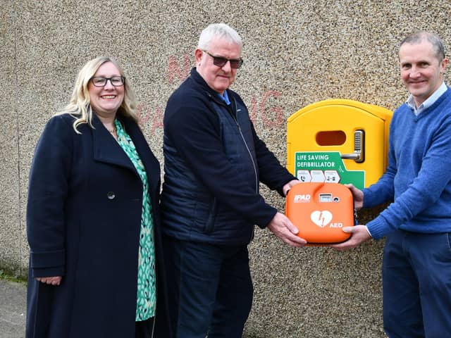 A new defibrillator has been installed outside Michael Matheson MSP's office at the east end of Falkirk High Street.  Pictured, from left, Elaine Grant (Falkirk Delivers business manager); Martin Stuart (trustee, Friends of Forth Valley First Responders) and Michael Matheson MSP.  (Pic: Michael Gillen)