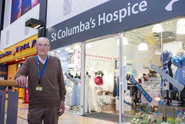 David Flucker celebrated his 100th birthday on June 22, but still went into work at St Columba's Hospice shop the next day as usual
Pic: Katielee Arrowsmith\SWNS