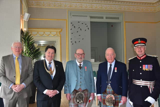 The Anderson brothers receive BEMs for services to piping at ceremony in Callendar House, left to right, Deputy Lieutenant Neil MacDonald, Provost Robert Bissett, Thomas Anderson, Peter Anderson and Lord Lieutenant Alan Simpson.