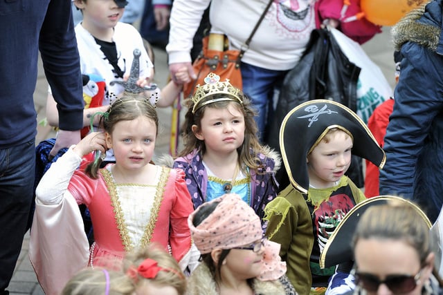Princesses and a pirate in the middle of the parade.
