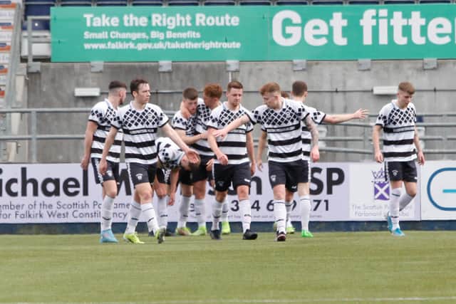 Shire players celebrate the opening goal