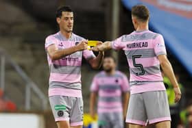 Partick Thistle's Brian Graham gives the captains armband to Aaron Muirhead as he substituted off during a Viaplay Cup group stage match between Dundee United and Partick Thistle at Tannadice, on July 18, 2023, in Dundee, Scotland (Photo by Mark Scates/SNS Group)