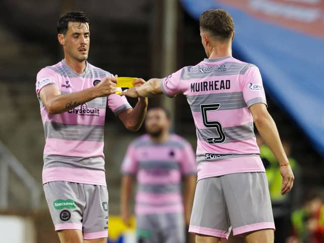 Partick Thistle's Brian Graham gives the captains armband to Aaron Muirhead as he substituted off during a Viaplay Cup group stage match between Dundee United and Partick Thistle at Tannadice, on July 18, 2023, in Dundee, Scotland (Photo by Mark Scates/SNS Group)