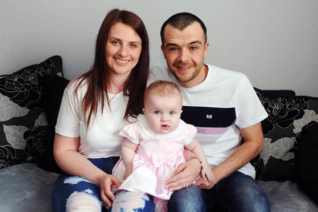 Lily with mum Nikki Aitken and dad Gary Graham at the family's Grangemouth home.  Pic: Michael Gillen.