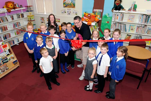 Over the years Stuart has visited hundreds of schools across the country and abroad.  Here he is opening Airth Primary's refurbished library in 2014.  Pic: Michael Gillen.