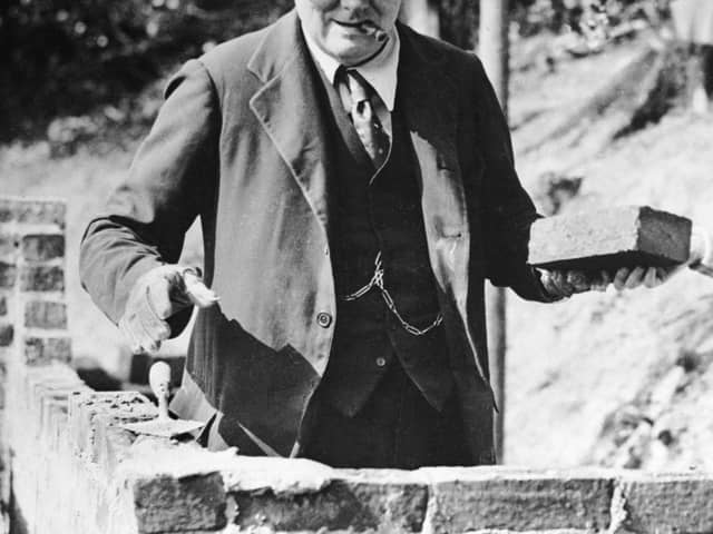 Winston Churchill carrying out some brick work at his home in Chartwell, Kent, in 1928 (photo: Getty Images)