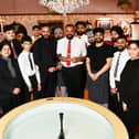 Boota Singh, owner of Gulnar Tandoori, with sons Jaskaran and Navjot, and the rest of the family and staff after the restaurant was named Outstanding Indian Restaurant of the Year at the Scottish Curry Awards.  (Pic: Michael Gillen)