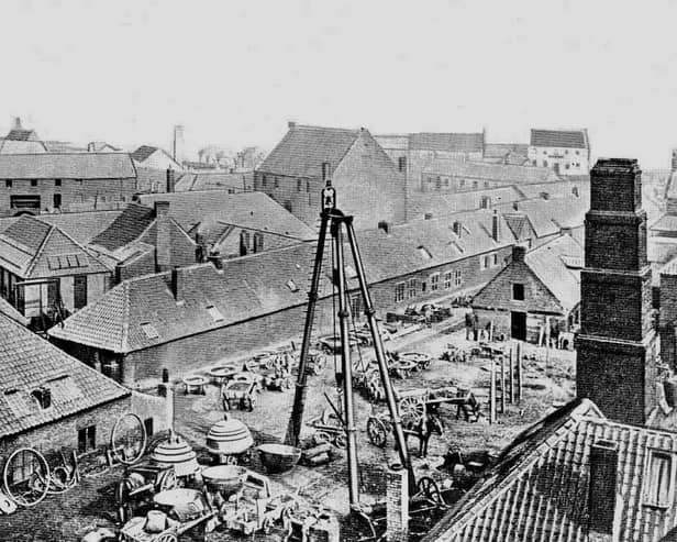 The Carron Iron Works 'triangle' with its bell on top.