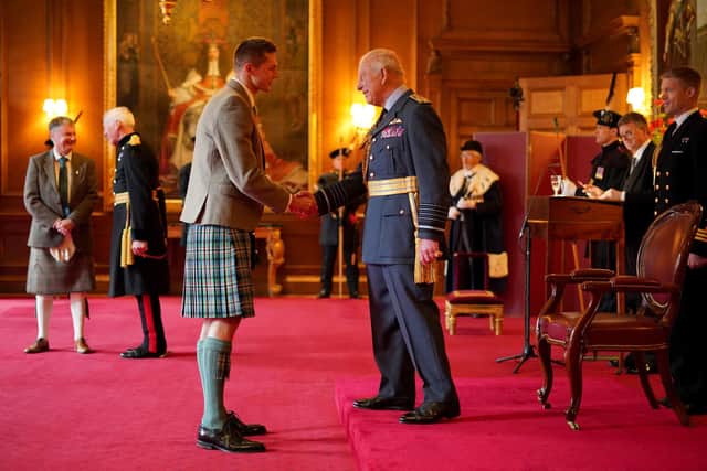 Duncan Scott receives his OBE from King Charles. Pic: Jane Barlow/PA Wire