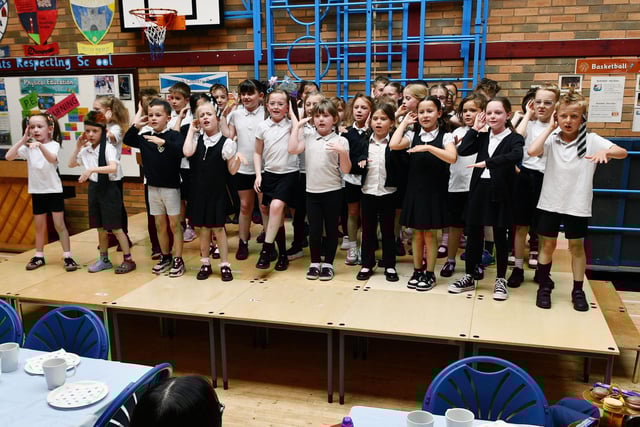 Primary 4 and primary 5 pupils entertain the guests at this years Dunipace Primary School Thank You Tea