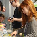 Emma Dillon (5) making a structure to hold a tennis ball out of straws at last year's Innovate event in Zetland Park, Grangemouth.  (Pic: Alan Murray)