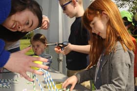 Emma Dillon (5) making a structure to hold a tennis ball out of straws at last year's Innovate event in Zetland Park, Grangemouth.  (Pic: Alan Murray)