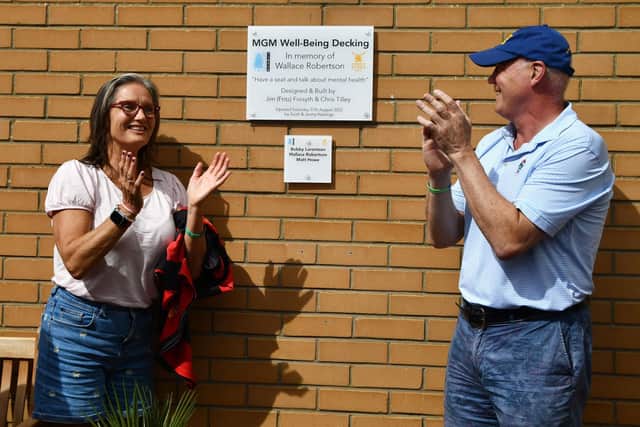 The unveiling of the plaque by Jenny and Scott Hastings