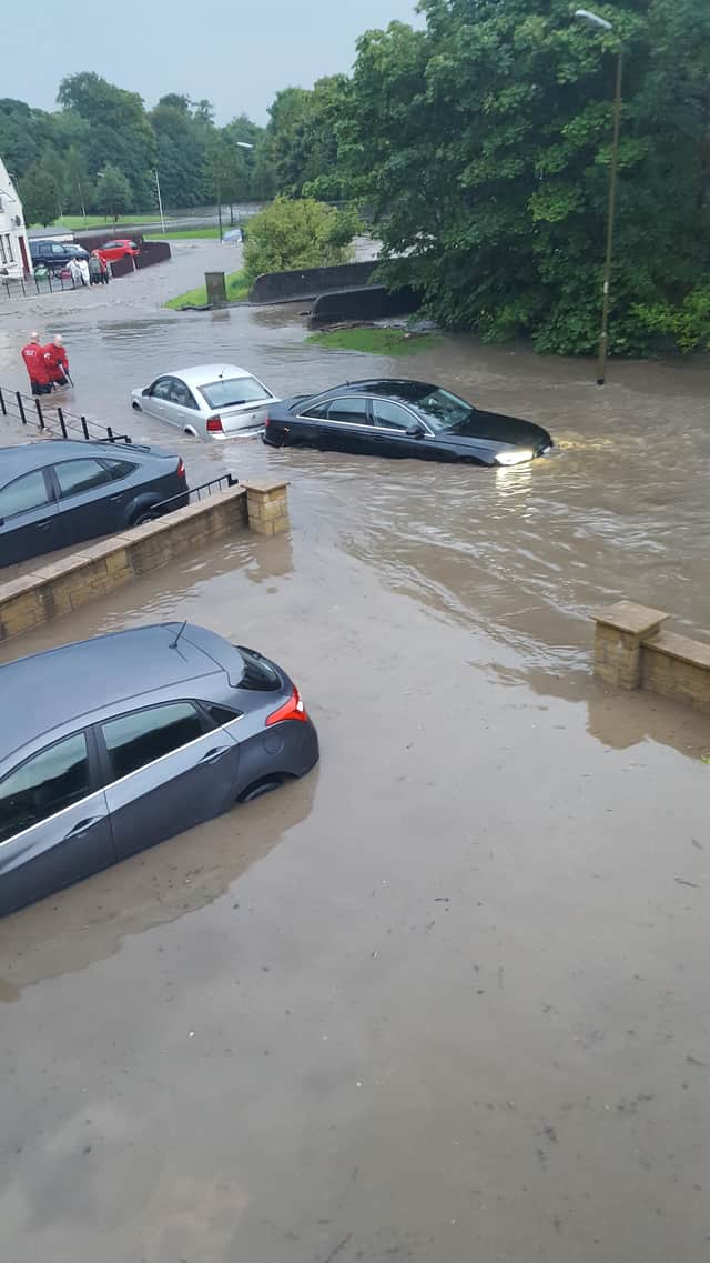 Residents' homes and cars were left deep in water after the Westquarter Burn burst its banks.  (pic: Stuart Murray)