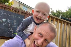 Archie Galloway, who was diagnosed with cancer at the onset of the coronavirus pandemic in Scotland, with dad Andi, a former Bo'ness Fire Station officer.