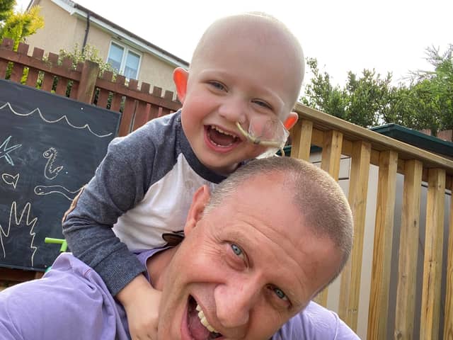 Archie Galloway, who was diagnosed with cancer at the onset of the coronavirus pandemic in Scotland, with dad Andi, a former Bo'ness Fire Station officer.