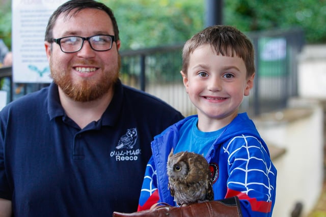 Watch the birdie ... Reece from Owl Magic with Harry, four, from Denny with Lily the owl