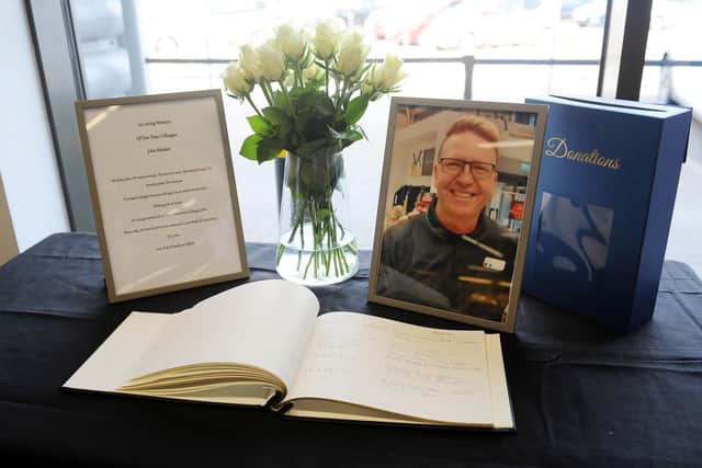A book of condolences has been set up in M&S Foodhall for former employee John McAleer. Picture: Michael Gillen.
