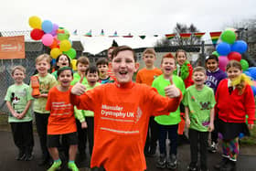 Frazer Murphy is joined by schoolmates from St Francis Xavier's RC Primary to support  Muscular Dystrophy UK's Go Bright Day.