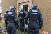 Officers execute a warrant in Camelon during Operation Kendrew (Picture: Michael Gillen)
