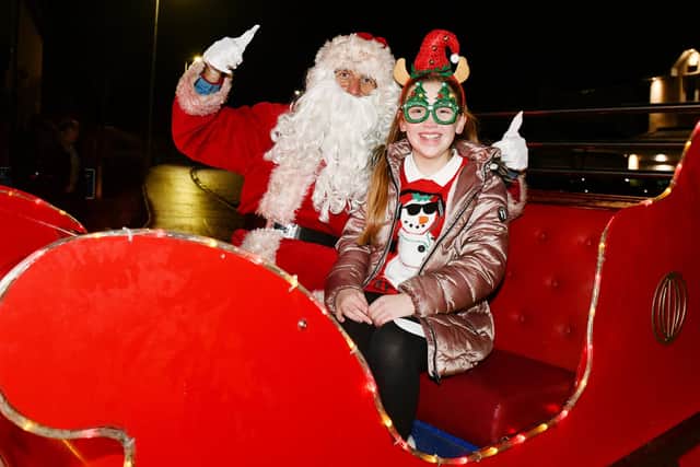 Ten-year-old Ellie Wilson met Santa as Falkirk Round Table's fundraising sleigh toured the streets.