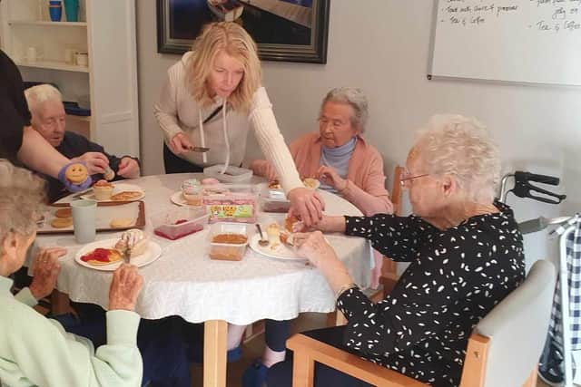 Residents at Carrondale Care Home get involved in a baking and cake decorating session. Pic: Contributed