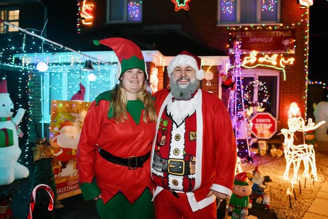 Gordon Miller and Pamela Miller collected over £800 for Forth Valley Sensory Centre with their Christmas lights display. Picture: Michael Gillen