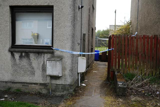 Police tape around a flat in Drumpark Avenue, Falkirk (Photo: Michael Gillen).