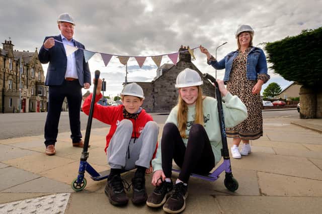 Gala Queen and Herald, Sofia and Oliver, alongside Iain Innes, the Managing Director for Dandara East Scotland and Stephanie Wilson, the President of Kirkliston Gala. Photograph: Mike Wilkinson.