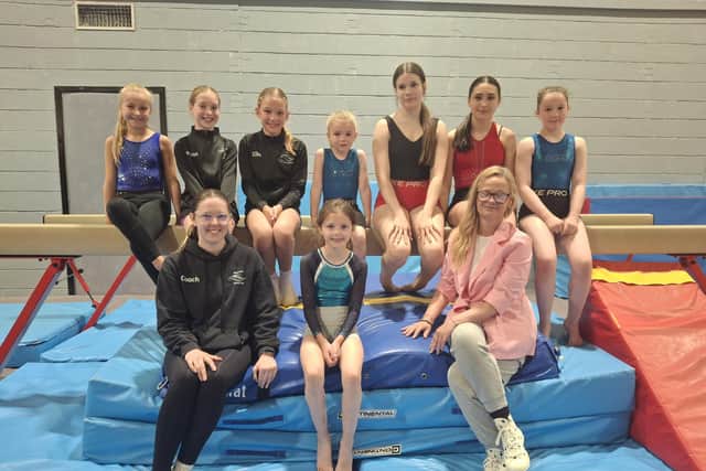 Members of Stenhousemuir Gymnastics Club with coach Kirsten McKay and chair Marnie Foster. Pic: Contributed