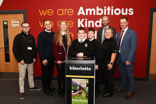 Pictured: Ross Guthrie, waste services education officer; Robert Hamilton, teacher; Susie Hoggan; Logan Marshall; Ross Hamilton; Liam Mason, teacher, PC Abigail Meason, school based officer and Stuart Kelly, head teacher. Pic: Michael Gillen