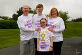 Ashlee (13) with dad Donald, mum Lisa and brother Jayden (15) taking part in last year's Braes High School Family Walk to raise money for her appeal fund. Picture: Scott Louden.
