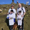 Finlay Wilson, 8, with mum Gayle, dad Steven and big brother Callan as they climbed Dumyat on Sunday to mark three years since Finlay's open heart surgery.  (Pic: submitted)