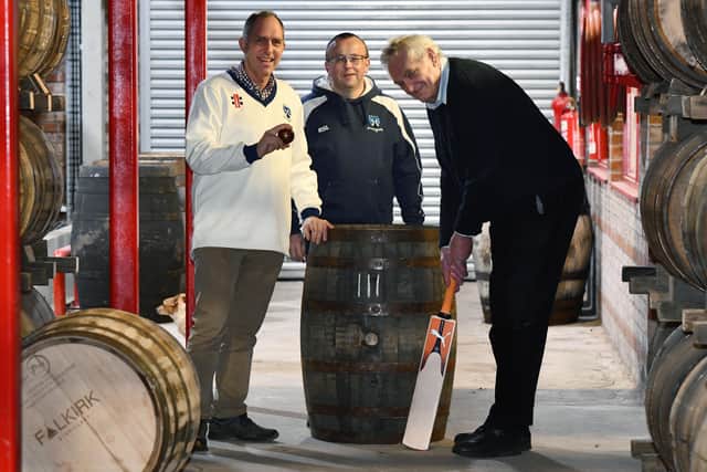 Whisky barrel donation, left to right, Alan Reed, cricket club trustee; Stephen Sutton, cricket club trustee and George Stewart, distillery founder.