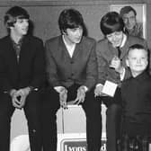 A young kilted fan gets to meet the Beatles at the ABC cinema in Edinburgh in 1964 - (l-r) Ringo Starr, John Lennon, Paul McCartney, George Harrison