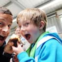 Bear Grylls and his son Marmaduke Grylls share a cupcake