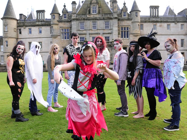 Colleena Brodie from Strathcarron Hospice with people dressed up as ghosts and zombies in promo picture for Halloween spooky walk. Centre, Amy Cardno, 10, from Larbert.