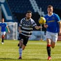 Shire's Robbie Young battles for possession in one of their meetings this campaign with Rangers B (Picture: Scott Louden)