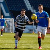 Shire's Robbie Young battles for possession in one of their meetings this campaign with Rangers B (Picture: Scott Louden)