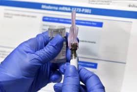 A nurse prepares a syringe to administer a Covid vaccine. Picture: AP Photo/Hans Pennink