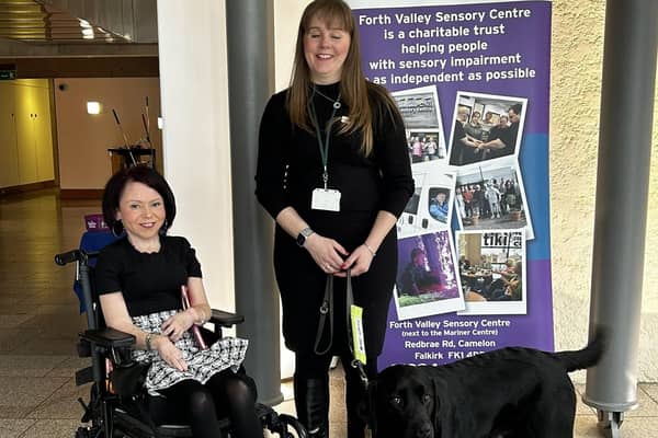 MSP Pam Duncan-Glancy meets Laura Cluxton and her guide dog Sadie at the Forth Valley Sensory Centre stand in Holyrood